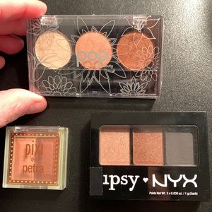 Set of three eye shadow palettes